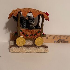 Silvesteri Stewart skunk/squirrel Choo Choo ride figurine.